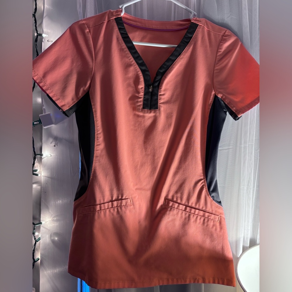 Peach and Grey colored scrub top, gently used. Unknown brand. Size Small
